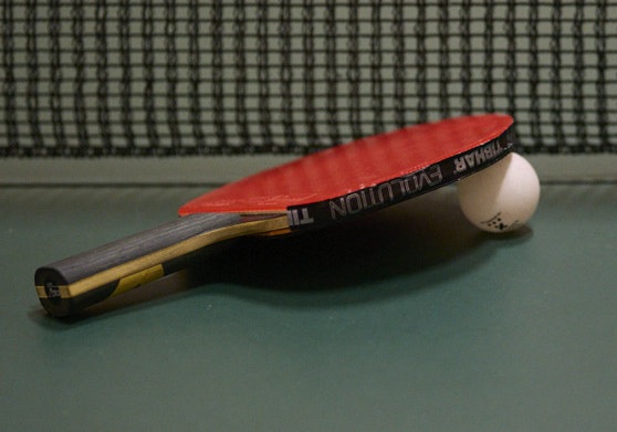 image of table tennis bat and ball